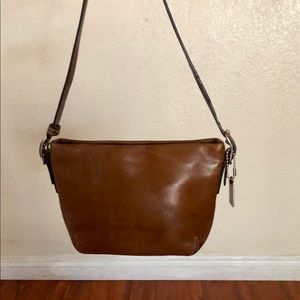 Small brown leather coach shoulder/wristlet bag